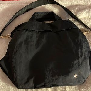 Lululemon bag w lots of room.  Can be held by handles or crossbody!
